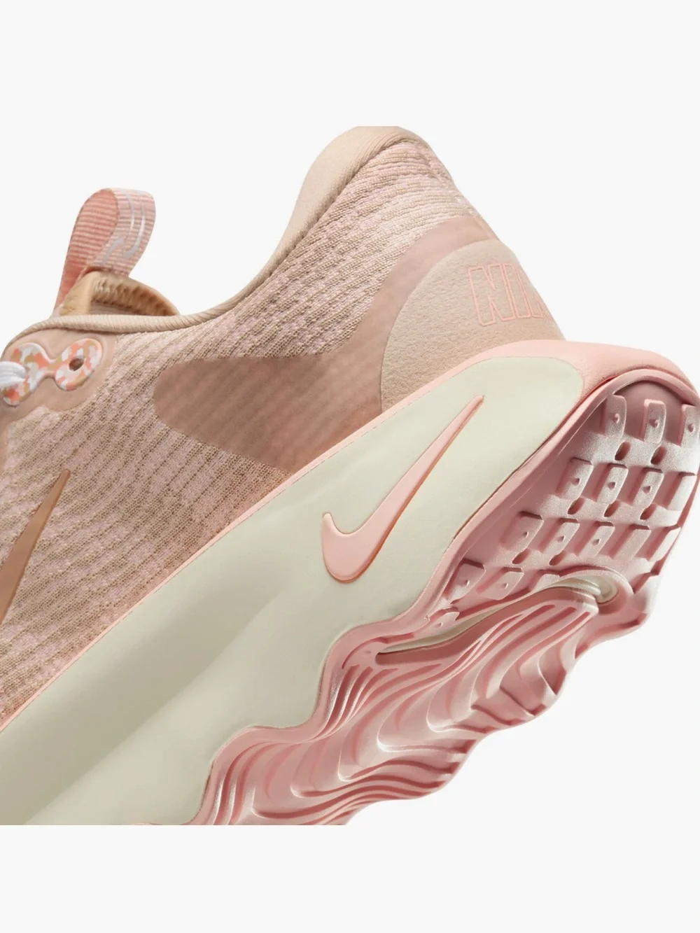 Nike Women’s Peach/Pink Wave-Soled “Motiva” Athletic Shoe